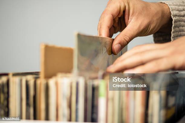Close Up On Hands Browsing Record Store Stock Photo - Download Image Now - Picking - Harvesting, Adults Only, Analog