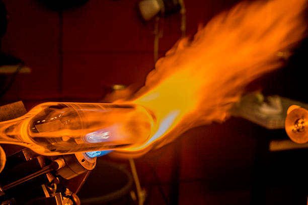 glass artisans working close up of glass artisans working with torch hand blown glass stock pictures, royalty-free photos & images