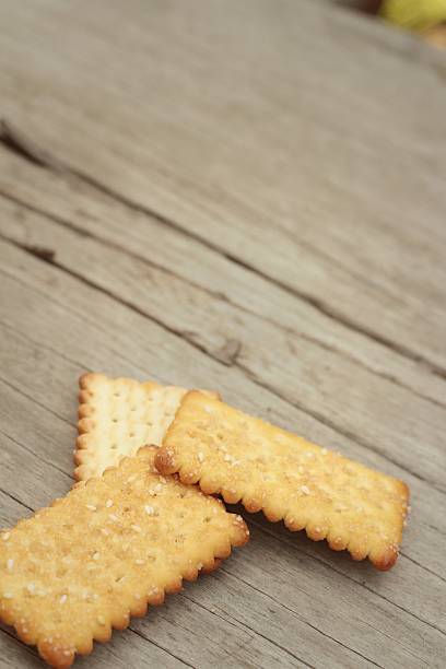 istock Tasty of crackers on a wood table 476659588