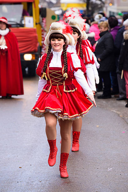 Cologne, Germany - March 03, 2014: unidentified crowd of colorful painted and costumed people at Rose Monday parade in Cologne