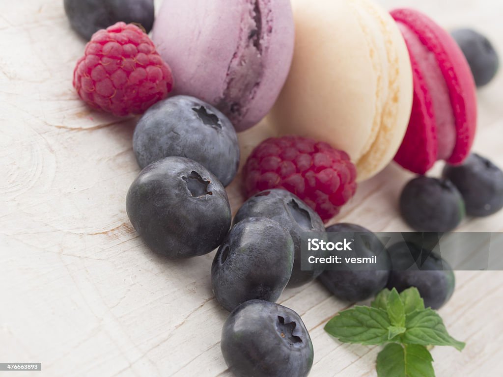 tasteful macaroons with fruit Arrangement Stock Photo
