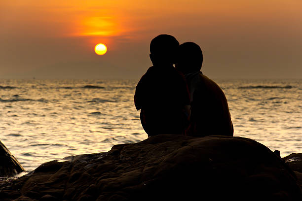 istock kid on the beach at sunrise 476664079