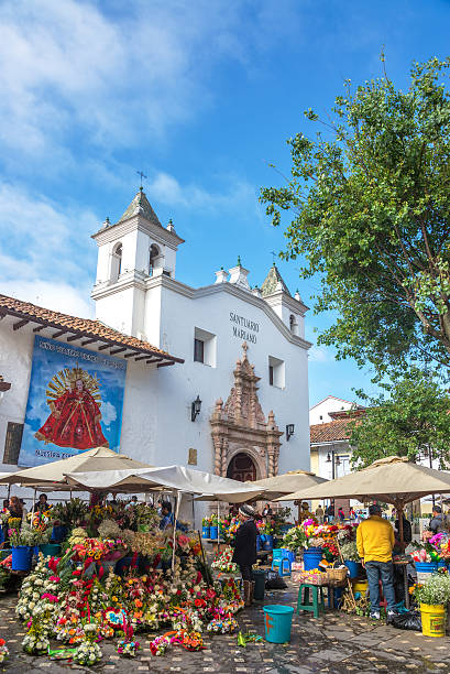 Flower Vendors in Cuenca, Ecuador Cuenca, Ecuador - December 14, 2014: Flower sellers in front of a church on December 14, 2014 in Cuenca, Ecuador cuenca ecuador stock pictures, royalty-free photos & images