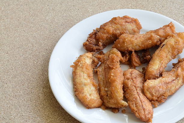 istock sweetened fried bananas in white plate 476670746