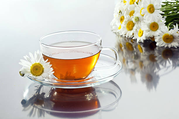 istock Transparent cup with green tea and fresh herbal bouquet 476671013