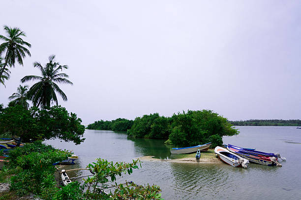 Small island in the middle of Rio Dulce and fisherman with raft, Izabal.