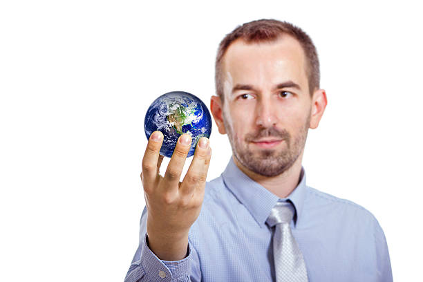 istock Young businessman holding a Globe 476674588