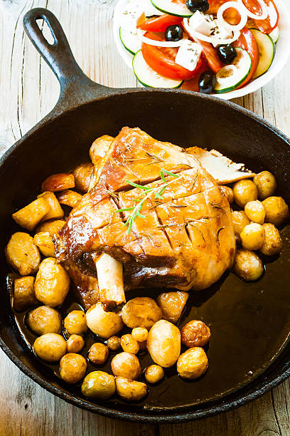 Lamb Meat with Potatoes in cast iron pan.