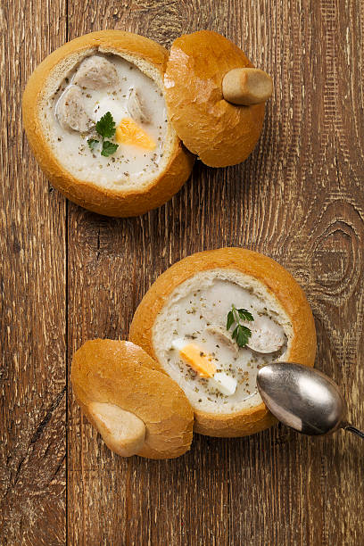 istock Traditional polish white borscht with eggs and sausage in bread 476676988