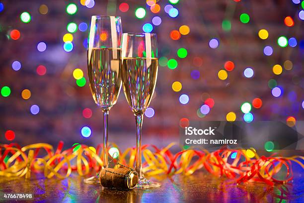 Two Champagne Glasses Ready To Bring In The New Year Stock Photo - Download Image Now