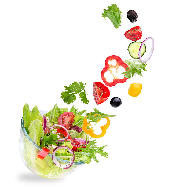 istock Fresh salad with flying vegetables ingredients 476678608