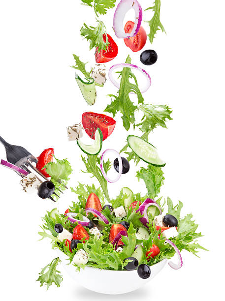istock Fresh salad with flying vegetables ingredients 476678620
