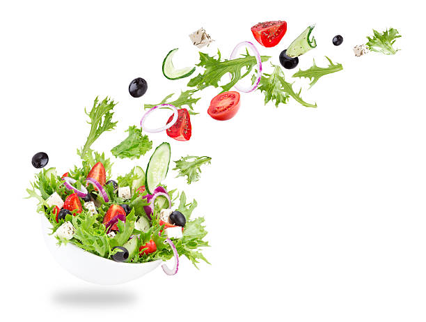 istock Fresh salad with flying vegetables ingredients 476678632