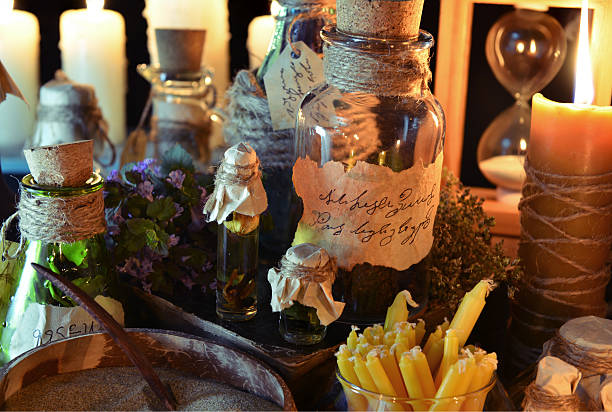 istock Still life with tagged bottles and candles. Witch table 476679248