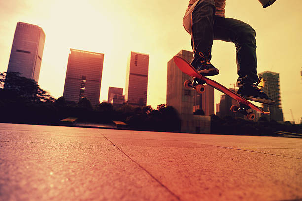 istock skateboarder doing skateboarding trick ollie on city 476679992