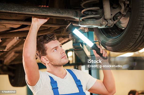 Checking Every Detail For Defects Stock Photo - Download Image Now - 2015, Adult, Adults Only