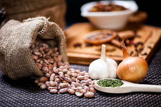 winter ingredients such as bean seeds, onions and garlic winter ingredients such as bean seeds, onions and garlic or dried hot spicy pepper red mung bean stock pictures, royalty-free photos & images