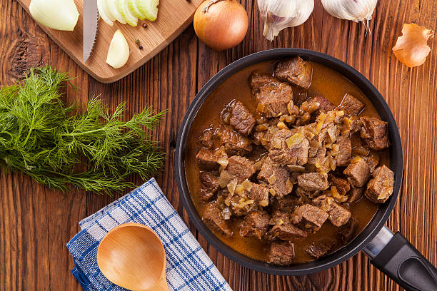 istock Beef stew - wooden background 476684746