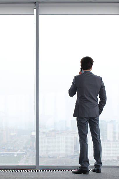 istock businessman with mobile phone 476688468