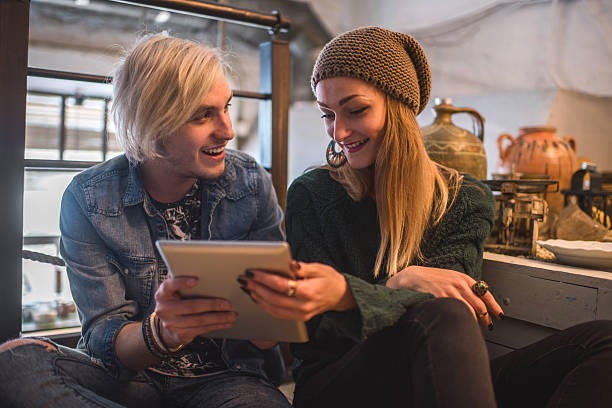 istock Young happy couple using digital tablet together. 476693560