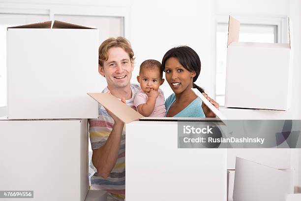 Young Family Moving Home Stock Photo - Download Image Now - 2015, Activity, Adult