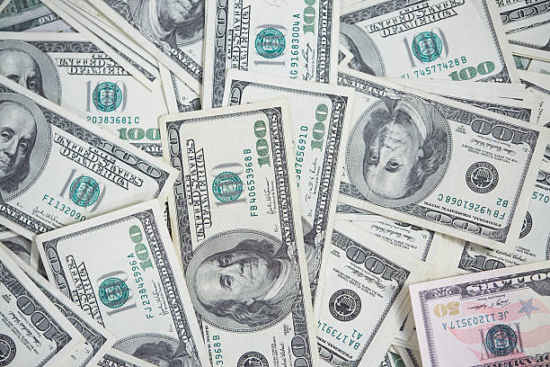 istock money in a chaotic manner on the floor 476695048