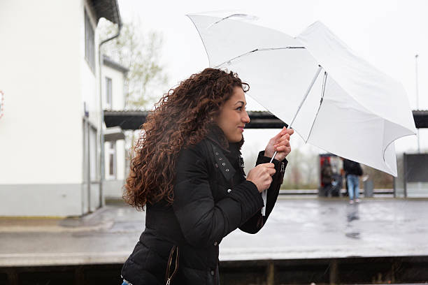 istock young woman outdoors rainy stormy weater 476696570
