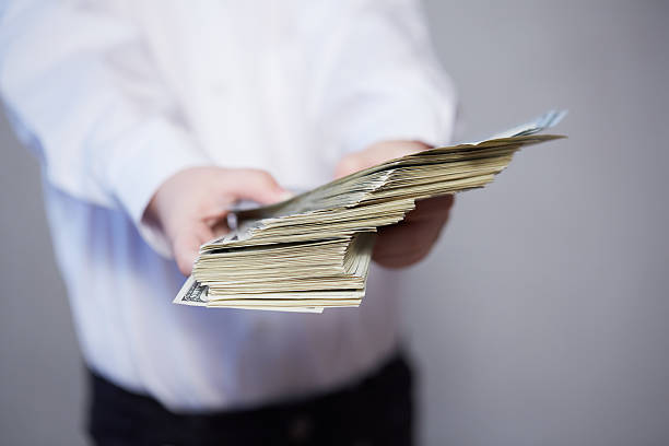 istock money in children's hands 476696984