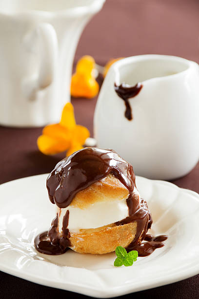 istock profiteroles with ice cream and chocolate. 476698885