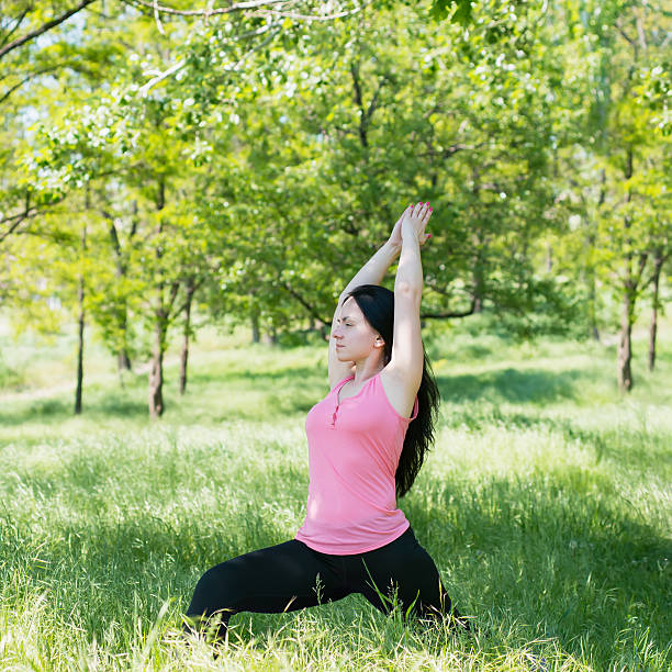 istock woman doing yoga 476700700