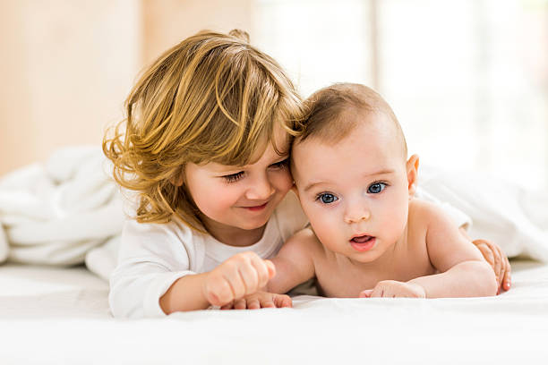 istock Loving little brothers lying down in bed. 476704132