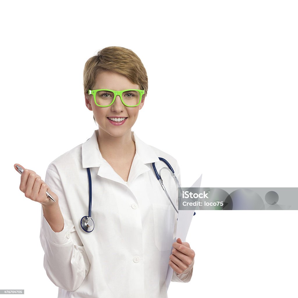 Cheerful female doctor with documents. Portrait of a smiling female doctor holding pen and documents. Waist up studio shot isolated on white. 20-24 Years Stock Photo