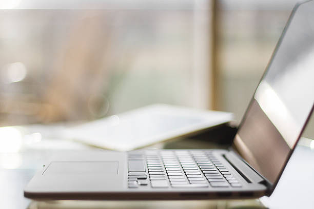 istock laptop on a table at home, shallow depth of field 476704764