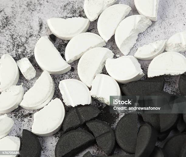 White And Black Tablets Stock Photo - Download Image Now - Broken, Pill, White Color