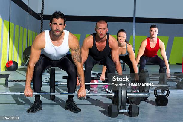 Gym Group With Weight Lifting Bar Gym Workout Stock Photo - Download Image Now - 20-29 Years, Active Lifestyle, Activity