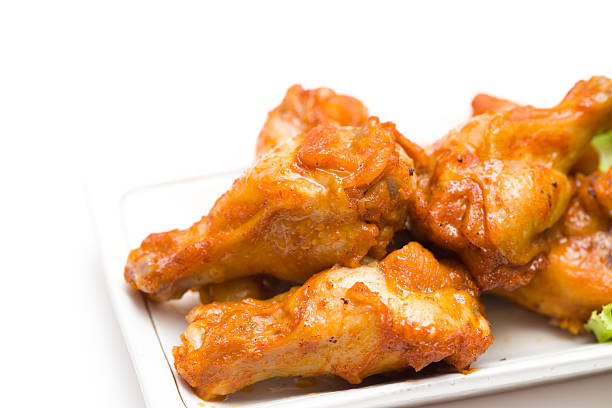 istock close-up grilled chicken drumsticks on white background 476708862