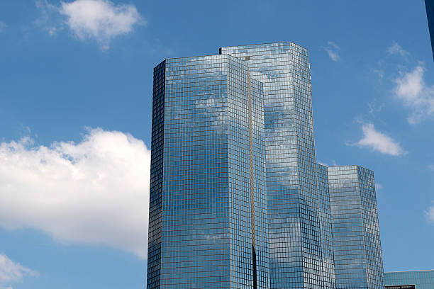 istock Skyscrapers from ground view with blue sky visible 476709364