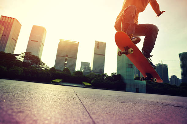 istock skateboarder doing skateboarding trick ollie on city 476711126