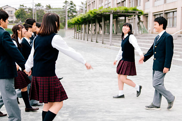 istock Japanese high school. Students exercise outside, building exterior, playground 476714000