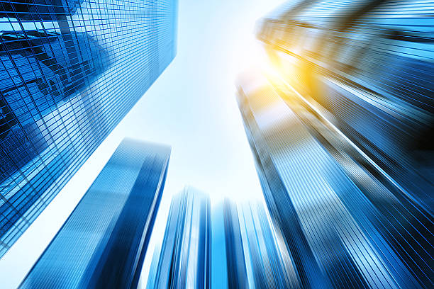 istock low angle view of skyscrapers in blurred motion. 476720372