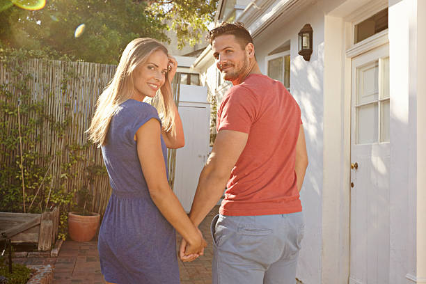 istock Young couple walking to their house 476720826