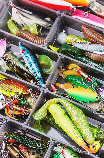istock fishing lures and accessories in the box background 476724078