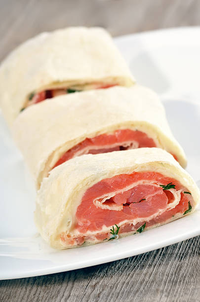istock Salmon lavash rolls with cheese and dill 476725130