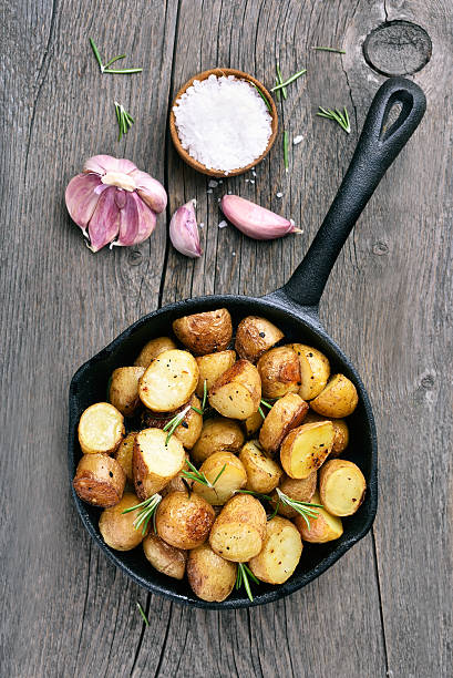 istock Roasted potato in frying pan 476725474