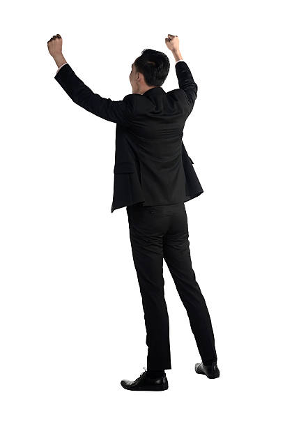 istock Backview of asian business man raise hand 476725740