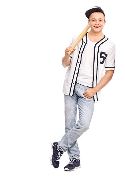 istock Young athlete holding baseball bat and leaning on a wall 476725750