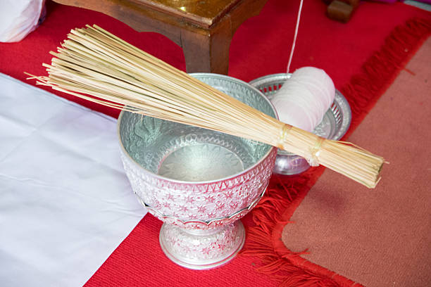 Thai holy water in water dipper Thai holy water in water dipper oracular stock pictures, royalty-free photos & images