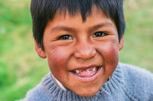 Happy little  aymara boy laughing