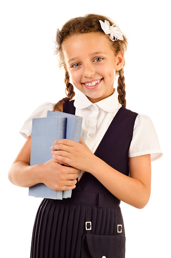 little schoolgirl isolated on a white background