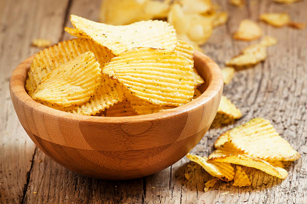 istock Rippled potato chips in a  bowl, selective focus 476726602